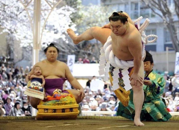 Wrestlers of sumo carried out traditional ritual