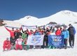 Aslanbek Hushtov hoisted the colors Save Olympic Wrestling campaigns on top of Elbrus